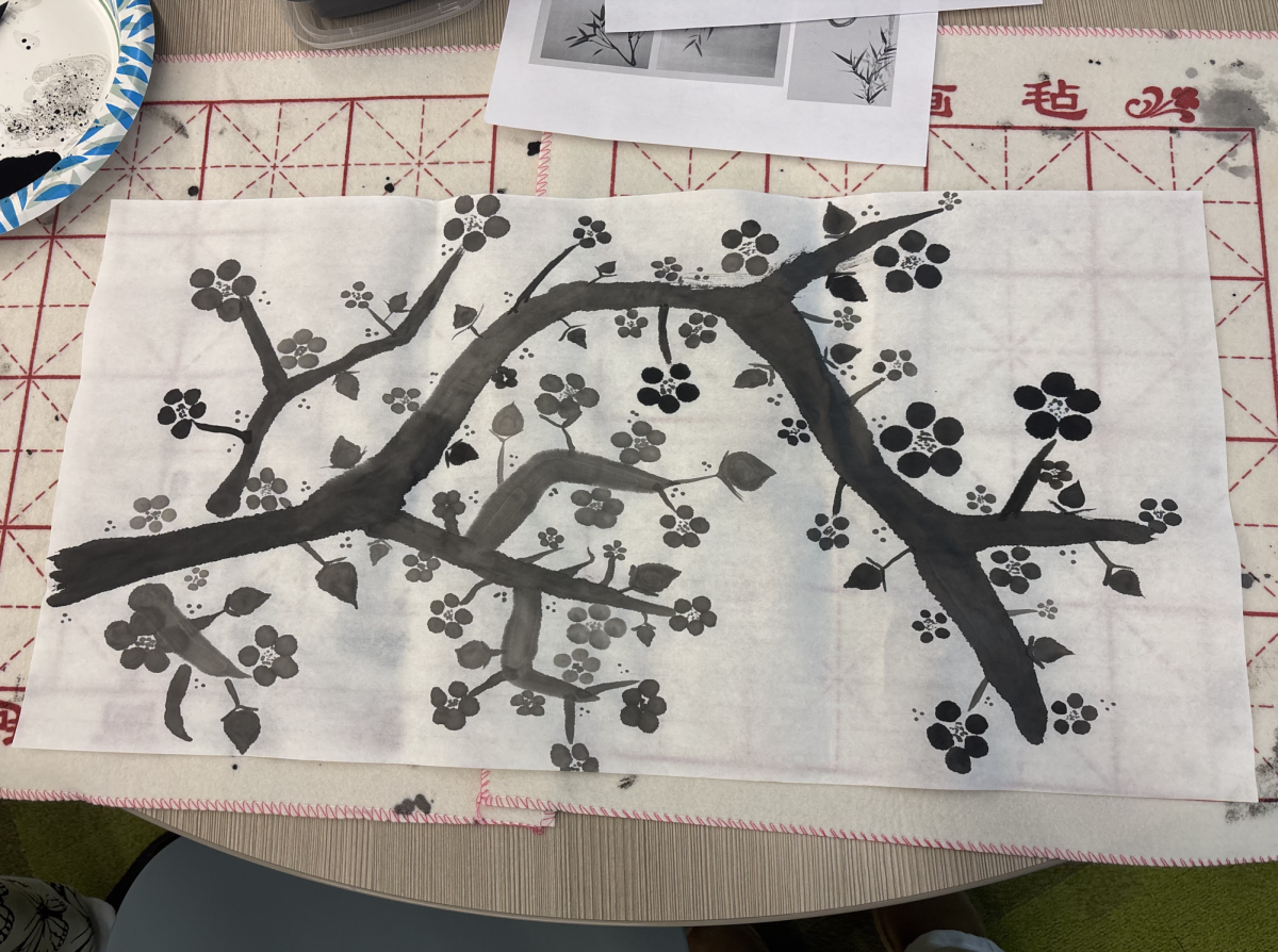 Students used ink wash painting techniques to create floral artwork that symbolizes the arrival of spring.